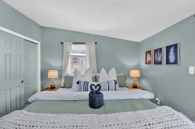 a bedroom with a large bed with a box on it at Palomino Ranch namaste-sunroom, hot tub, game room, king beds, fire pit, BBQ, pet-friendly in Tobyhanna
