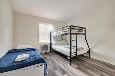 a bedroom with a bunk bed in a room at Spacious 5BR Home In Heart Of Poconos By Camelback Skiing Swimming Lake in Tobyhanna