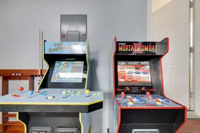 two video game machines sitting next to each other at Spacious 5BR Home In Heart Of Poconos By Camelback Skiing Swimming Lake in Tobyhanna