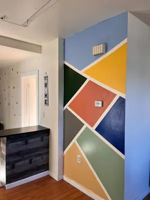 a wall in a room with a colorful wall at Amazing three bedrooms Apartment near EWR and NYC in Linden