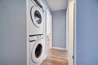 a laundry room with a washer and dryer at Charming Lakeside Retreat for 10 in Tobyhanna