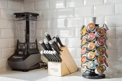 a kitchen counter with a knife block and a blender at Chic & Modern - 35 Mins to NYC - Extended Stays in Jersey City