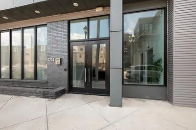 an entrance to a building with glass doors at Cozy Luxe Studio - Workstation WasherDryer in Philadelphia