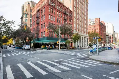 an empty street with a crosswalk in a city at Tribeca Studio w City views Gym Pool NYC-110 in New York