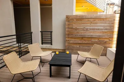 a group of chairs and a table on a patio at Sosuite at The Jefferson - Fishtown in Philadelphia