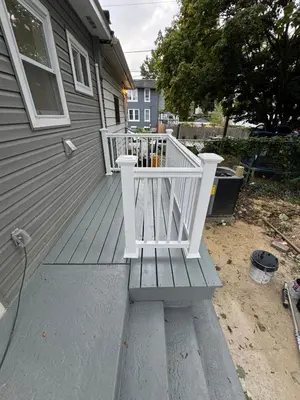 a porch with a white bench on the side of a house at Collingdale Home - Near Philly! in Collingdale