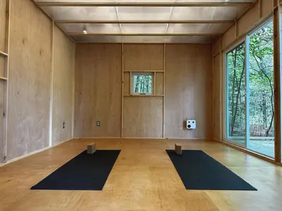a large room with two mats in the middle of it at Ranch in the Woods, a Peaceful Designer Retreat in Warwick
