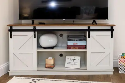 a tv on top of a white cabinet with a tv on top at Serenity Inn in Ronks