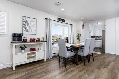 a kitchen and dining room with a table and chairs at Serenity Inn in Ronks