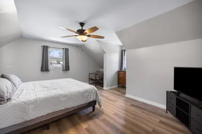 a bedroom with a bed and a ceiling fan at New House within Campground in Mifflinburg