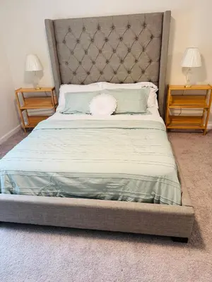 a bedroom with a large bed with two night stands at Warmth Private Room in Stillwater Lake Estates