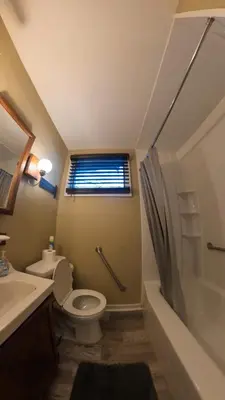 a bathroom with a toilet and a sink and a shower at 4Bedroom2Bath7GuestSleeper in Somerdale