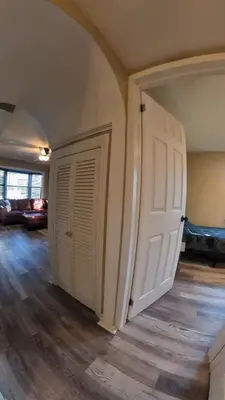a room with a door and a living room at 4Bedroom2Bath7GuestSleeper in Somerdale