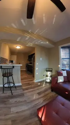 a living room with a couch and a table at 4Bedroom2Bath7GuestSleeper in Somerdale