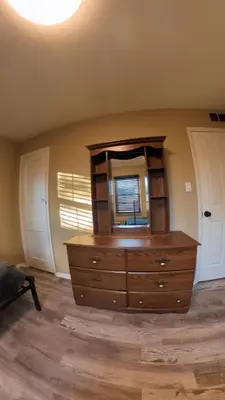 a room with a dresser with a mirror on it at 4Bedroom2Bath7GuestSleeper in Somerdale