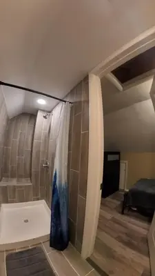 a bathroom with a shower with a shower curtain at 4Bedroom2Bath7GuestSleeper in Somerdale