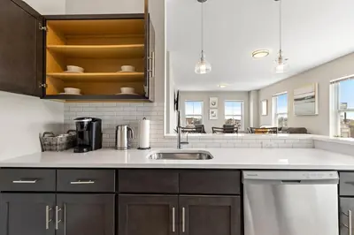 a kitchen with a sink and a counter at City Views 1BR Free-Parking- Easy NYC Access in Newark