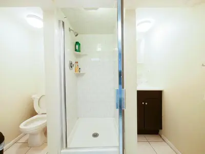 a bathroom with a shower and a toilet at Cozy Studio Unit Close to New York City in Jersey City