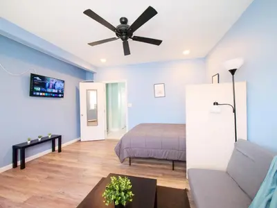 a bedroom with a bed and a ceiling fan at New Studio unit near the heart of NYC in Jersey City