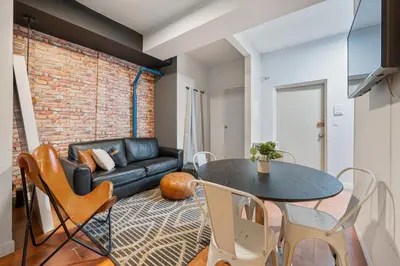 a living room with a table and a couch at 4 Bedroom 1 Bathroom Hudson Yard in New York
