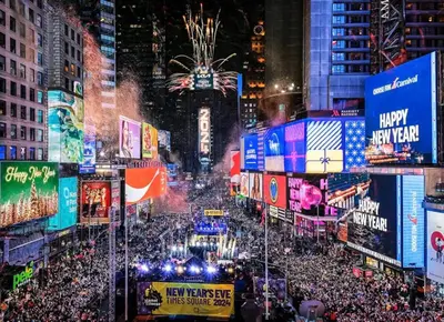 a crowd of people in a city at night at Modern Retreat Free Parking 30Min NYC in Bayonne