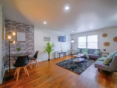 a living room with a couch and a table at Impressive 3bed 2bath apt close to NYC in Jersey City