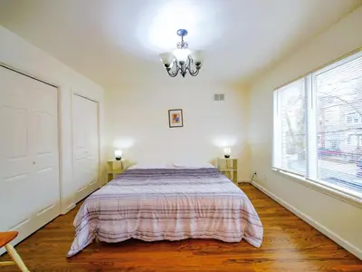 a bedroom with a bed and a window at Impressive 3bed 2bath apt close to NYC in Jersey City