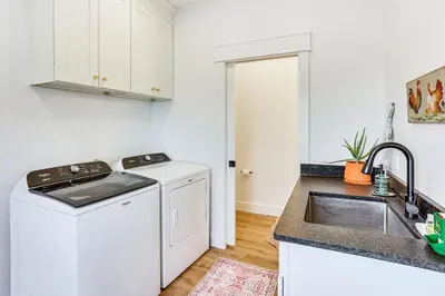 a white kitchen with a sink and a dishwasher at Walk to the Amish Village Spacious Ronks Getaway! in Ronks