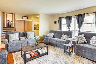 a living room with couches and a coffee table at 3 Mi to Berkshire Mall Suburban Stay with Yard! in Sinking Spring