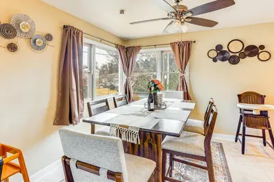 a dining room with a table and chairs at 3 Mi to Berkshire Mall Suburban Stay with Yard! in Sinking Spring