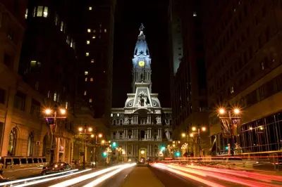 a city street with a clock tower on a building at Main Line Manor 3BR with King Beds & Patio & Backyard in Bryn Mawr