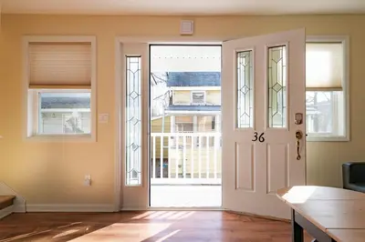 an empty room with a door with a window at Lovely 3BR Homewith free parking-WALK to WP Gate in Highland Falls