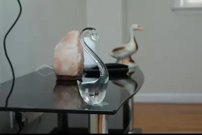 a glass item sitting on a glass table at Elegant 3BR Home - Near the Prudential Center in Newark