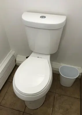 a bathroom with a white toilet in a room at Private one-bedroom and one-bathroom apartment with private street entrance in convenient area, MetLife Stadium FIFA World Cup 35 minutes away in Perth Amboy
