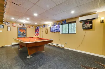 a billiard room with a pool table in it at Secluded Cabin, Jacuzzi, Pool Table, King Bed & Fire Pit in Bushkill