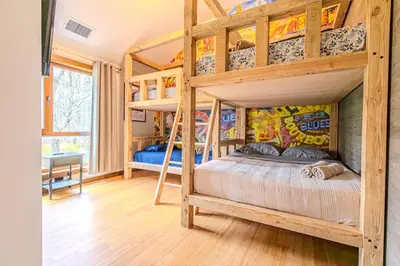 a bedroom with two bunk beds in a house at Pocono River front Home near Camelback Resort in Barton Glen