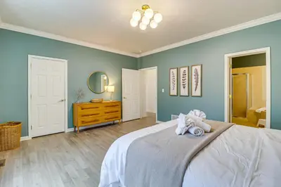 a bedroom with a bed with two stuffed animals on it at Screened Porch and Fire Pit Spacious Pocono Retreat in Pocono Pines