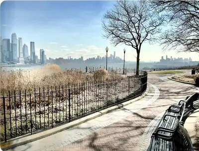 a park with benches and a view of a city at Apart Studio 12mint From New York City Times Square in West New York
