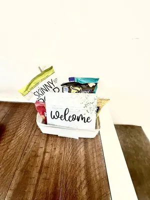 a box of junk sitting on the floor with a welcome sign at Apart Studio 12mint From New York City Times Square in West New York