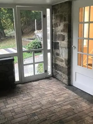 an entrance to a house with a white door at Charming Hudson Valley 3-Bedroom Family Getaway in Tomkins Cove