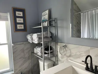 a bathroom with a towel rack next to a sink at Walk to WP Gate and Free Parking in Highland Falls