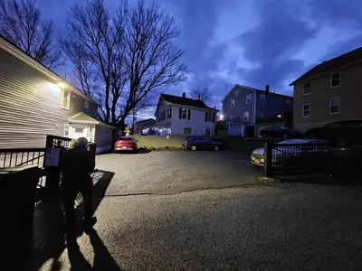 a man standing in the driveway of a house at Walk to WP Gate and Free Parking in Highland Falls