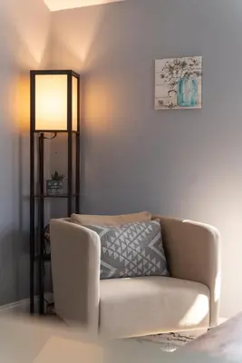 a living room with a couch and a lamp at Walk to WP Gate and Free Parking in Highland Falls