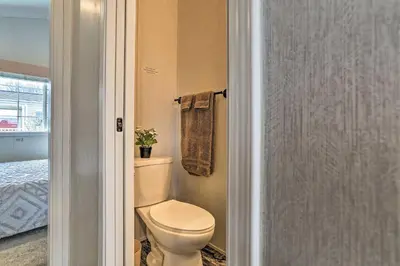 a bathroom with a toilet and a towel at 12 Bedroom Estate Experience 100 Acre Near Ski Area in Pleasant Mount