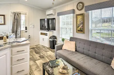 a living room with a couch and a kitchen at 12 Bedroom Estate Experience 100 Acre Near Ski Area in Pleasant Mount