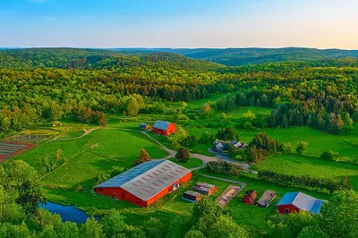 an aerial view of a farm with a barn at Suite to Unwind Close to Ski Slopes in Pleasant Mount