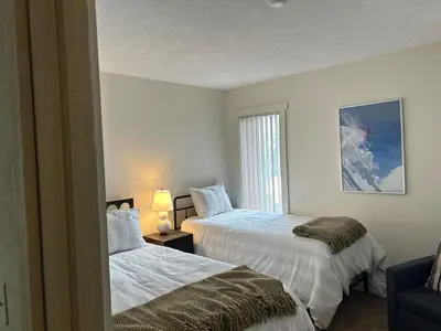 a bedroom with two beds and a window at Waterfront Mountain Fun-Jack Frost Walk On Whole House in Blakeslee