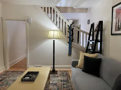 a living room with a couch and a table at Providence & 18th in Chester
