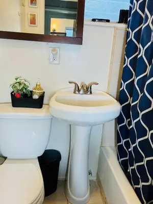a bathroom with a sink and a toilet at Providence & 18th in Chester