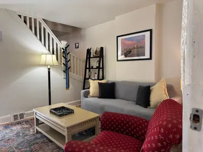 a living room with a couch and a table at Providence & 18th in Chester